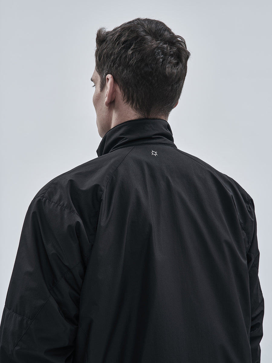 High stand collar with shaped back shoulder construction