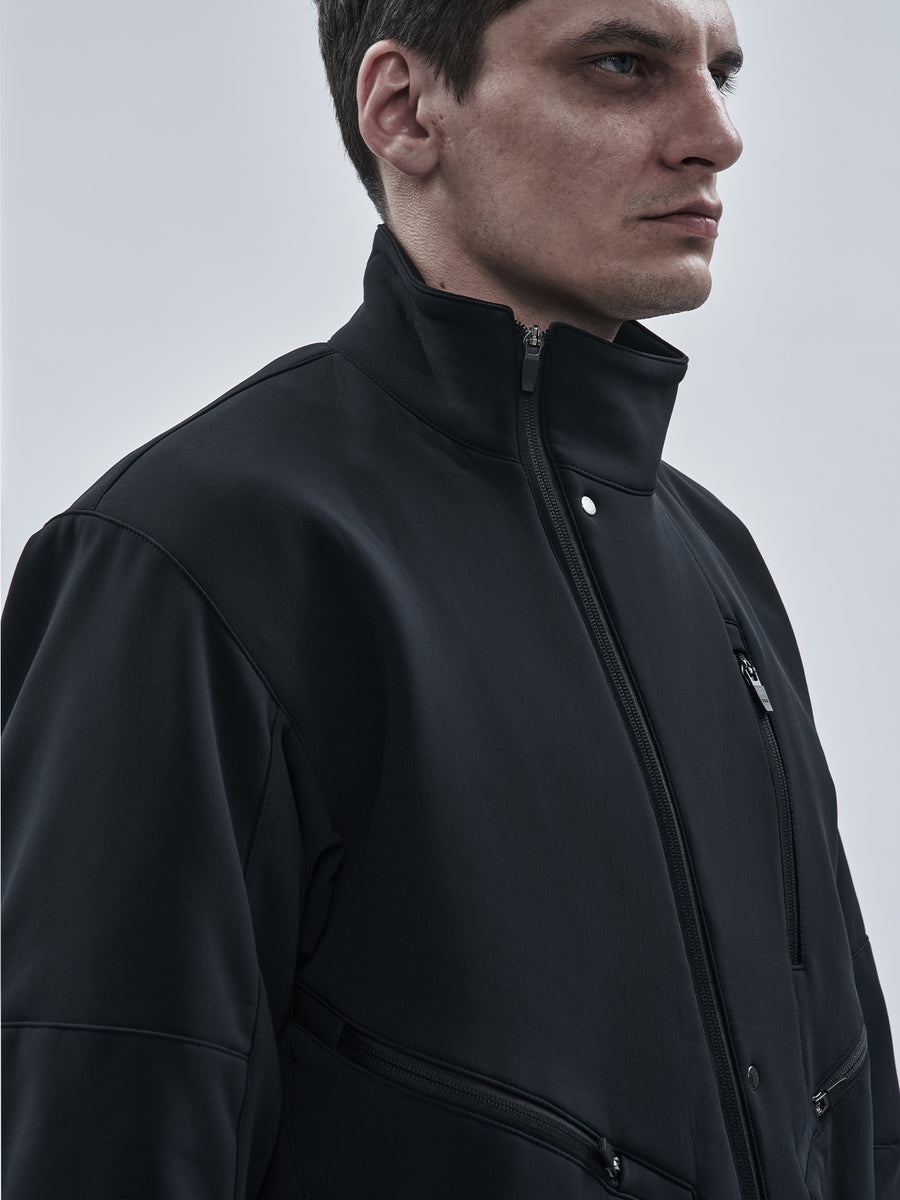 High stand collar with snap-fastened storm placket