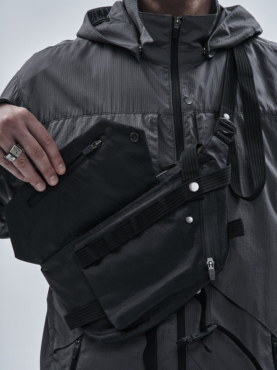 Concealed zipped pocket beneath front flap